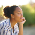 Hollister Therapy peaceful woman with hand on chin
