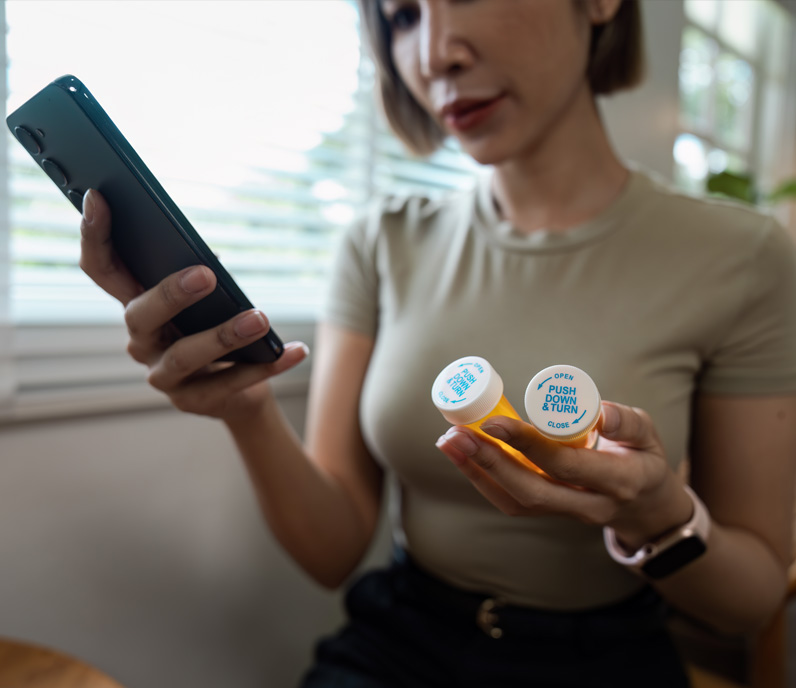 Woman Holding Pill Bottle