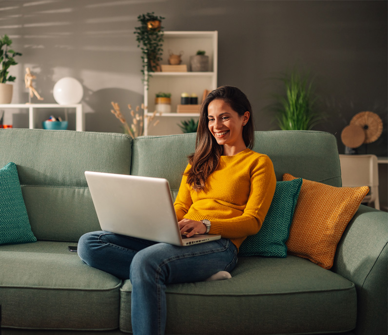 Happy Woman Using Laptop