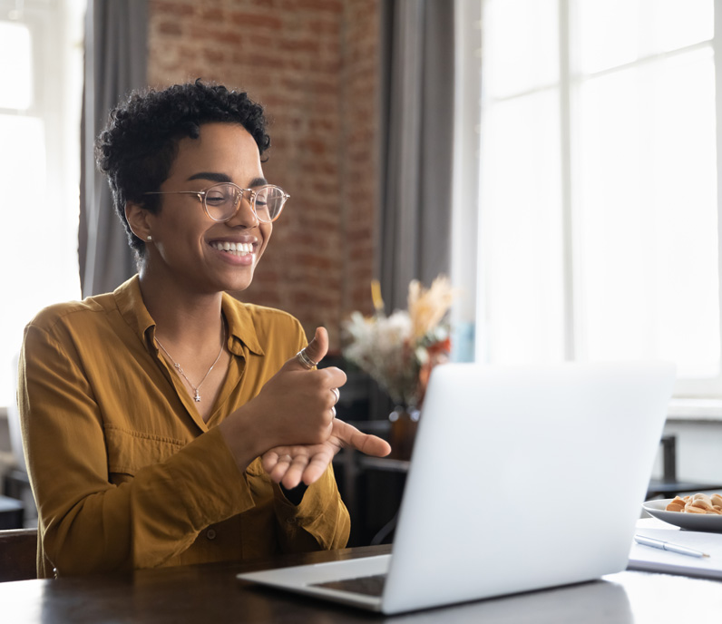 Happy Woman Using Laptop